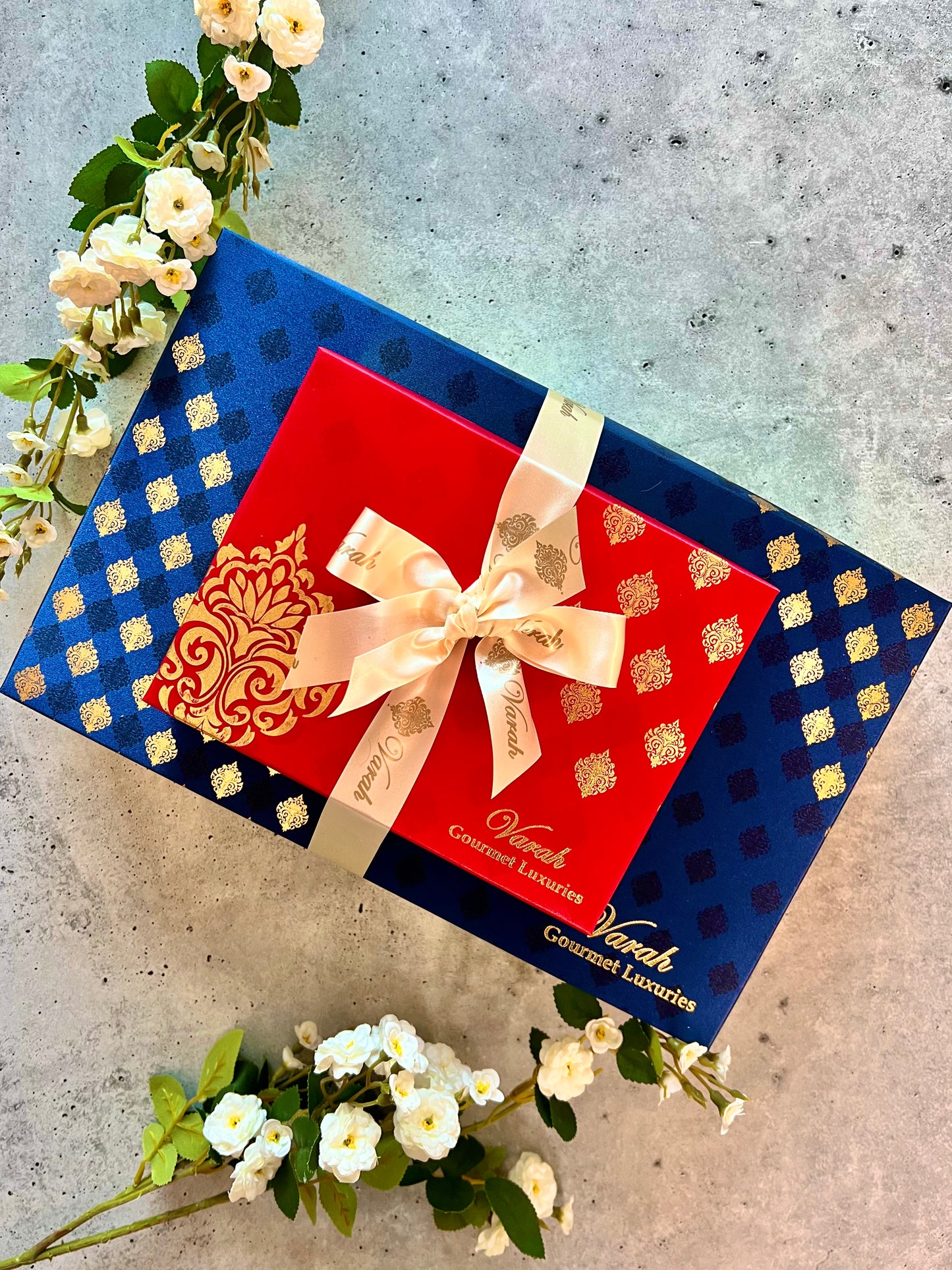 Gold Foiled gift boxes wrapped in a satin ribbon