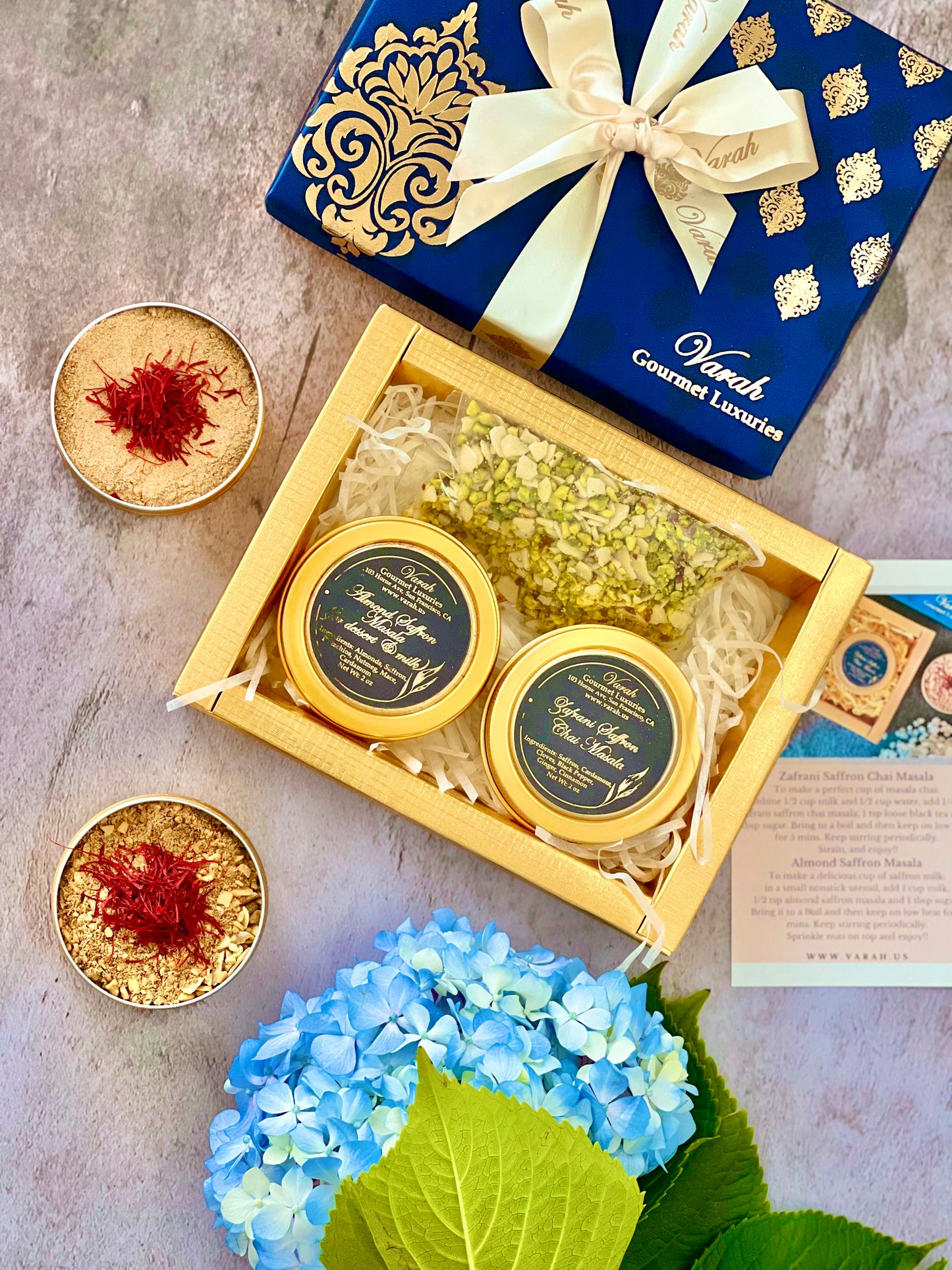Saffron Spice Blends - Milk Masala and Chai Masala in reusable tins, in a gold foiled gift box, wrapped with a satin ribbon