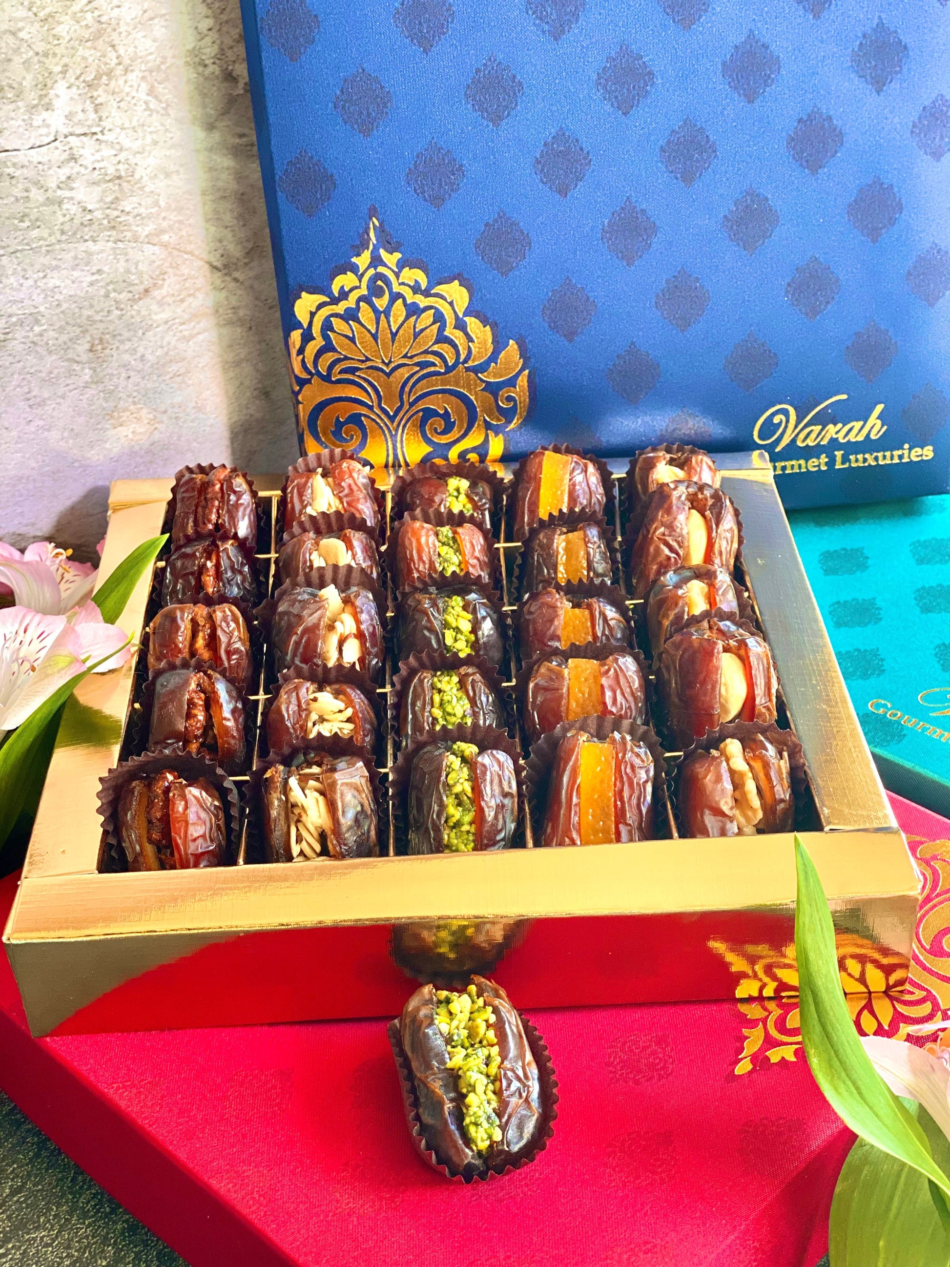 25 Piece Premium Stuffed Dates in a gold foiled gift box with a satin silk finish